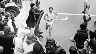Ron Hill crossing the finish line