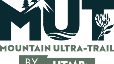 Mountain Ultra-Trail running event logo with forest, mountain, river, and floral elements, featuring "by UTMB" branding and a clean, modern design.
