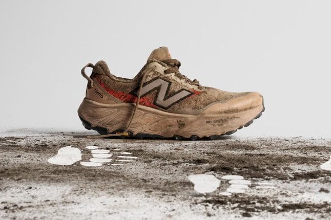 Trail running shoe covered in mud, ideal for off-road runners seeking durability and grip in challenging terrains. Perfect for outdoor running enthusiasts.