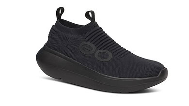 Black athletic running shoe with slip-on design and cushioned sole, ideal for running and sports activities.