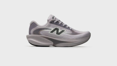 Light grey New Balance running shoe with cushioned sole and breathable mesh upper, ideal for running and athletic activities.