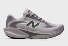 Light grey New Balance running shoe with cushioned sole and breathable mesh upper, ideal for running and athletic activities.