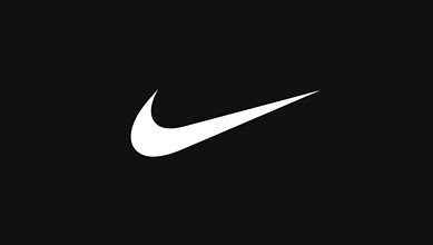 Close-up of Nike swoosh logo on black background, symbolising running and athletic performance.