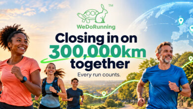 Group of diverse runners participating in a running event with a city skyline and a digital globe in the background, promoting community and global running efforts.
