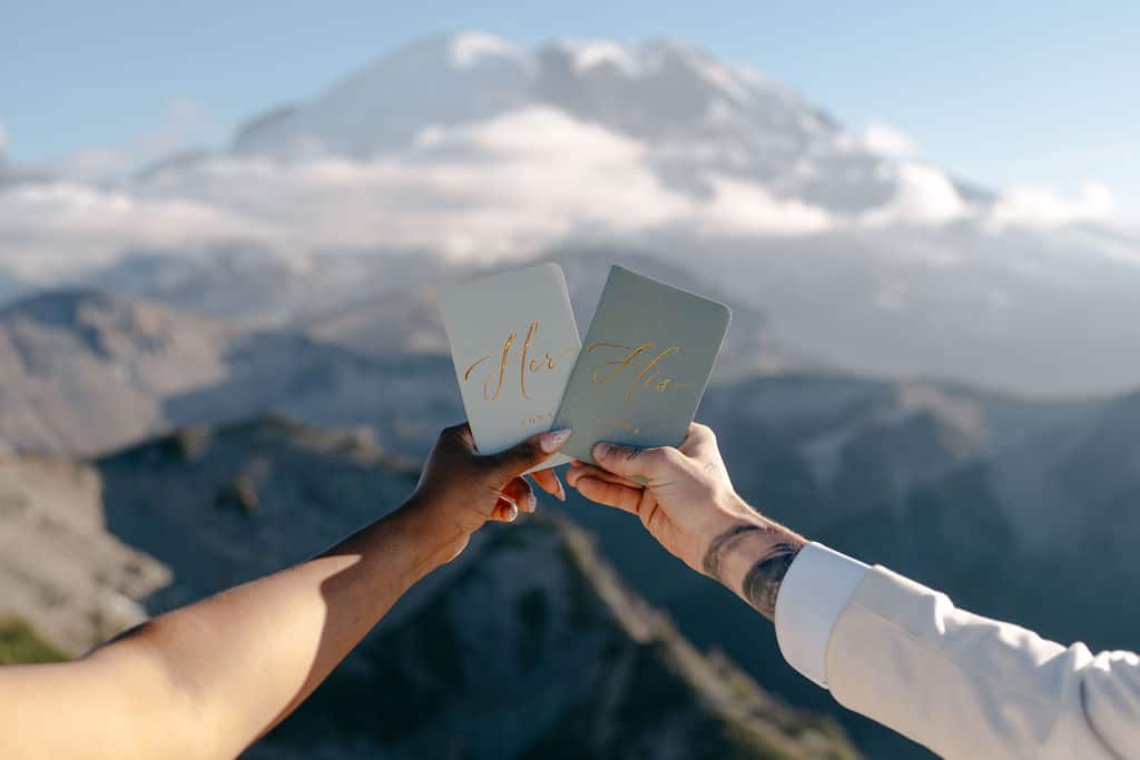 vow books in front of mount rainier