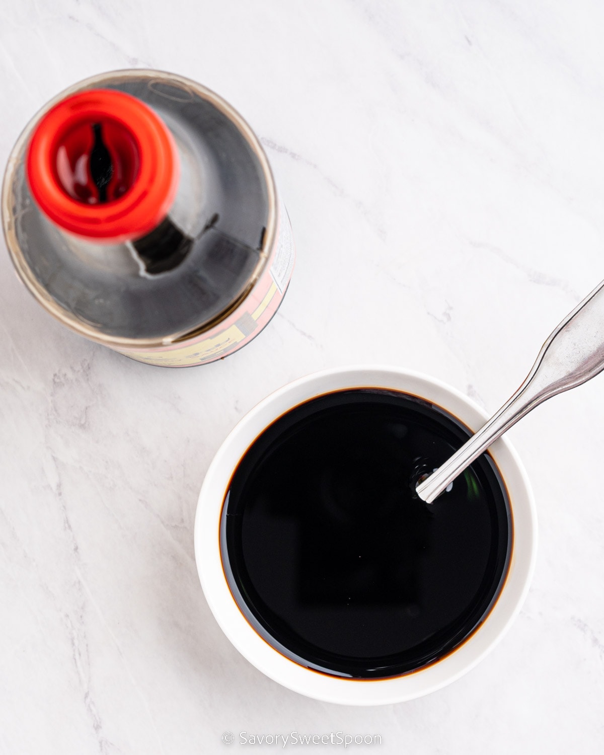 bottle and bowl of dark soy sauce.