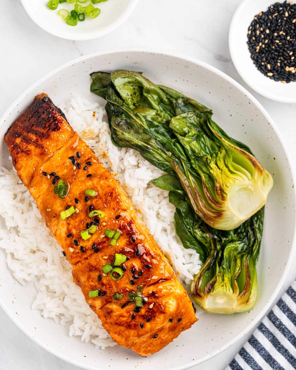 plate of miso glazed salmon and grilled bok choy halves.