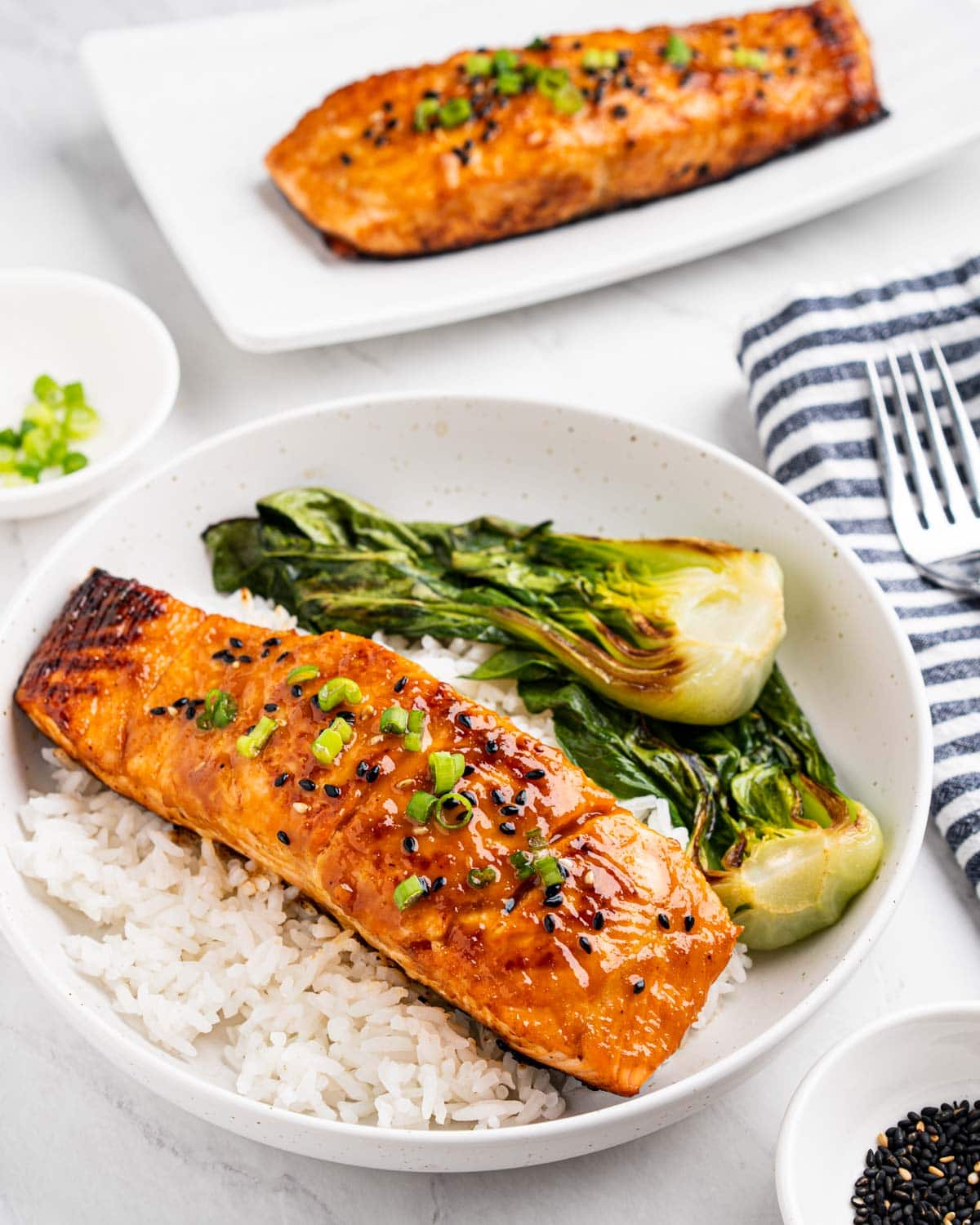 Miso glazed salmon on a bed of rice and bok choy.