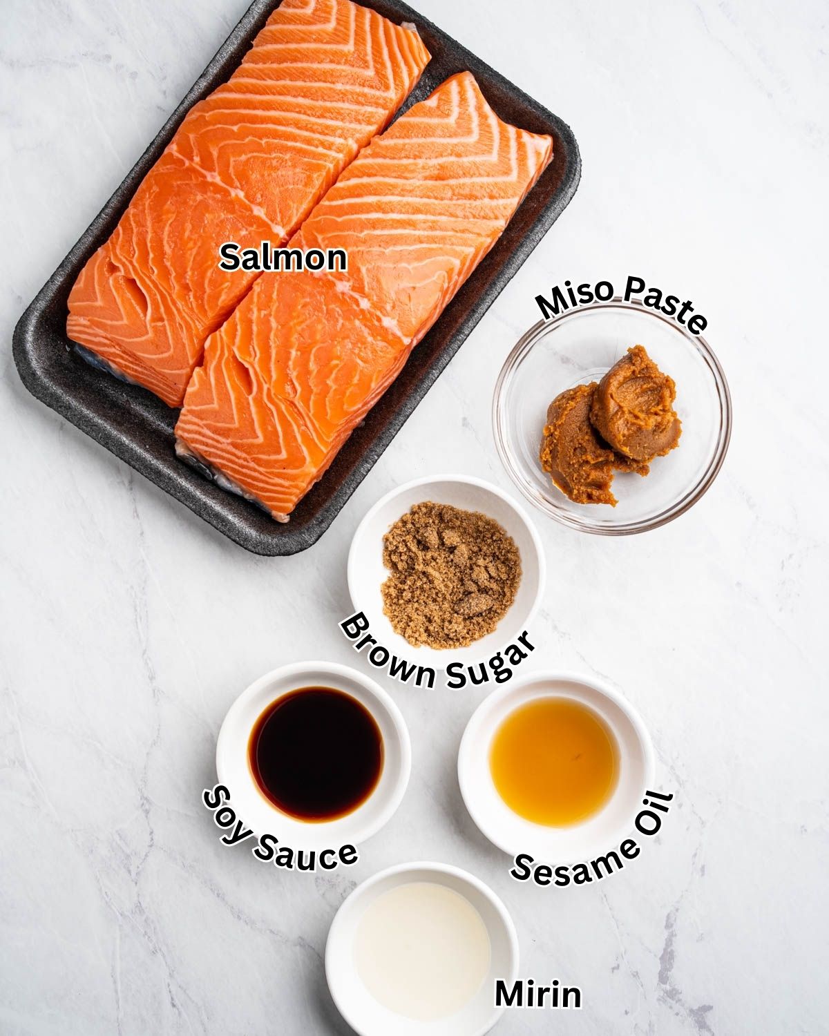 Ingredients for miso salmon: salmon, miso paste, brown sugar, soy sauce, sesame oil, and mirin.