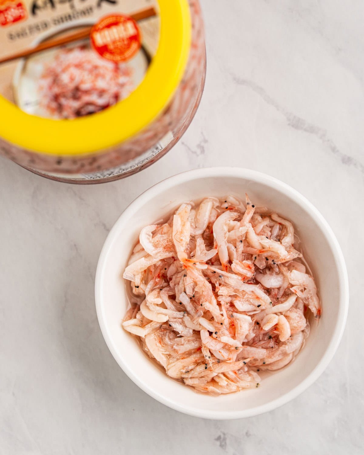top down of salted shrimp saeujeot in bowl.