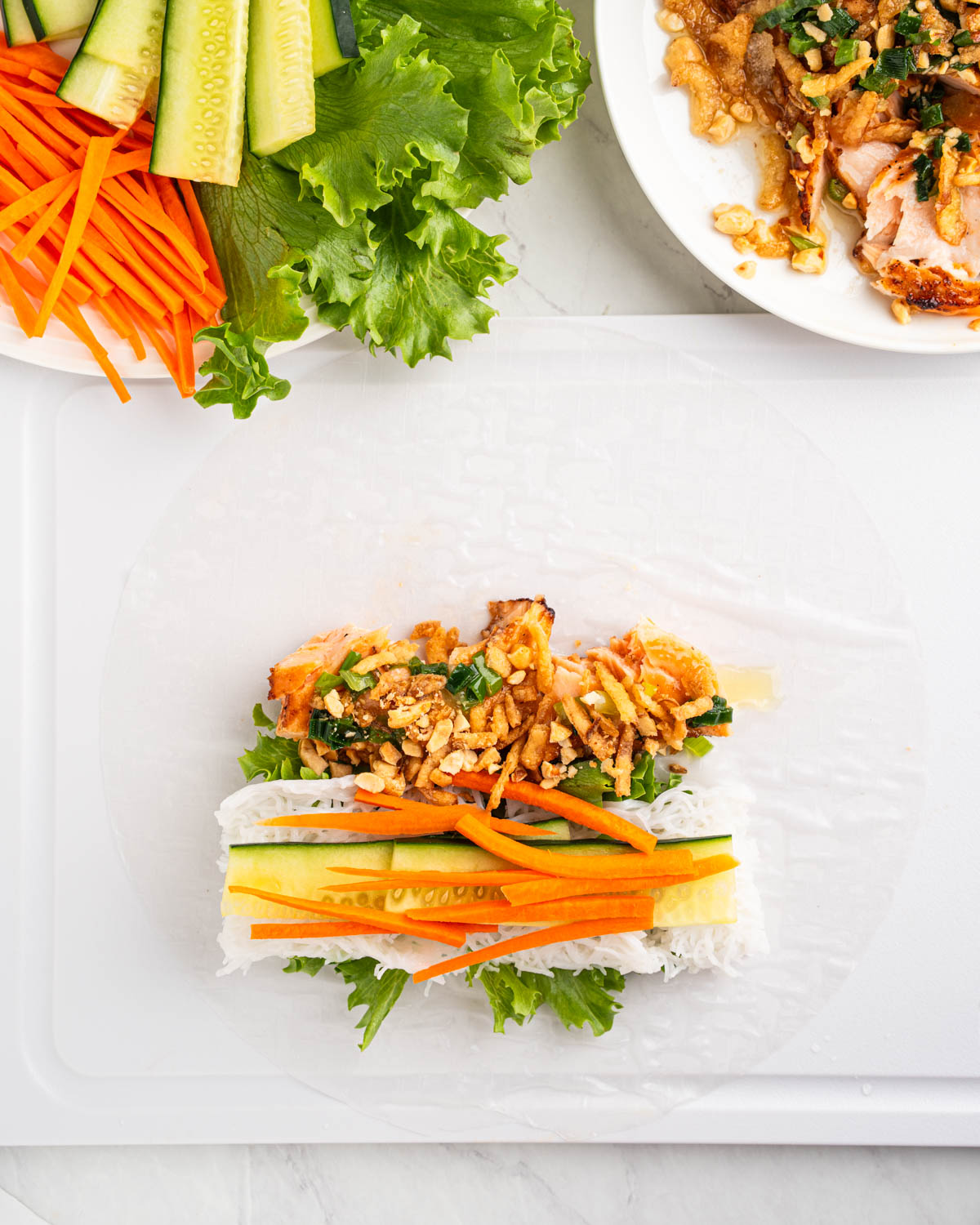 ingredients for salmon spring roll on rice paper.