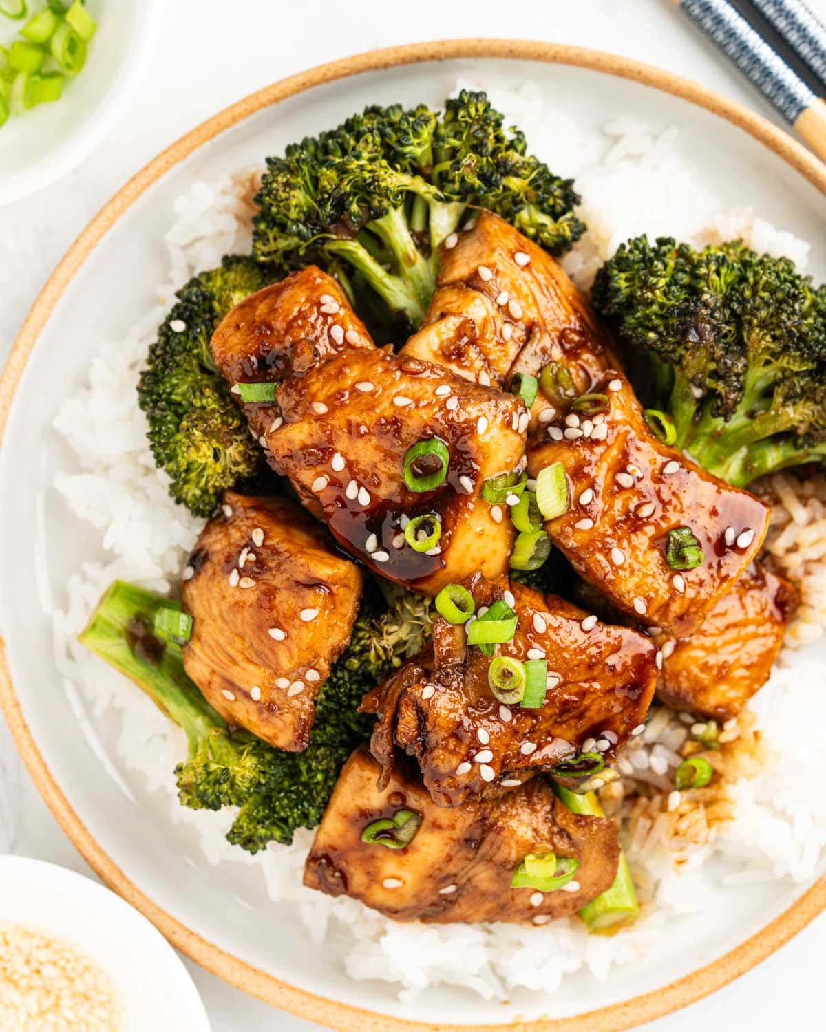 plate of teriyaki chicken and broccoli.