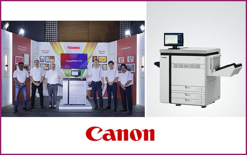 Canon team at an imagePRESS V770 launch booth beside the production printer