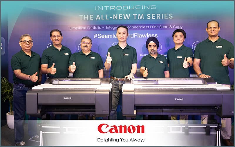 Group of people at Canon TM Series MFP launch event in India.