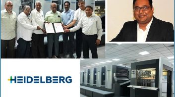 Group photo with HEIDELBERG printing press and executive portrait.