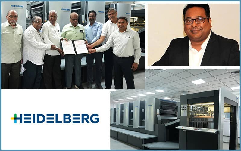 Group photo with HEIDELBERG printing press and executive portrait.