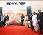 Group of people celebrating Hyundai's 30 years in India at Pune plant.