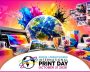 Print industry showcase with printing equipment and colorful designs for International Print Day 202.