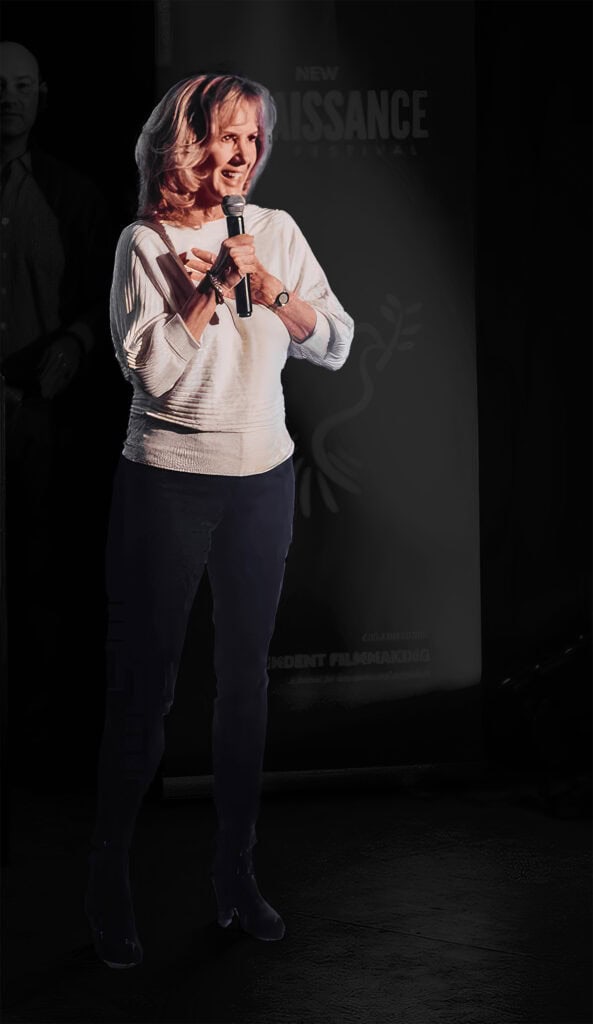 photo: Sheri Davenport delivering award speech at a film festival.
