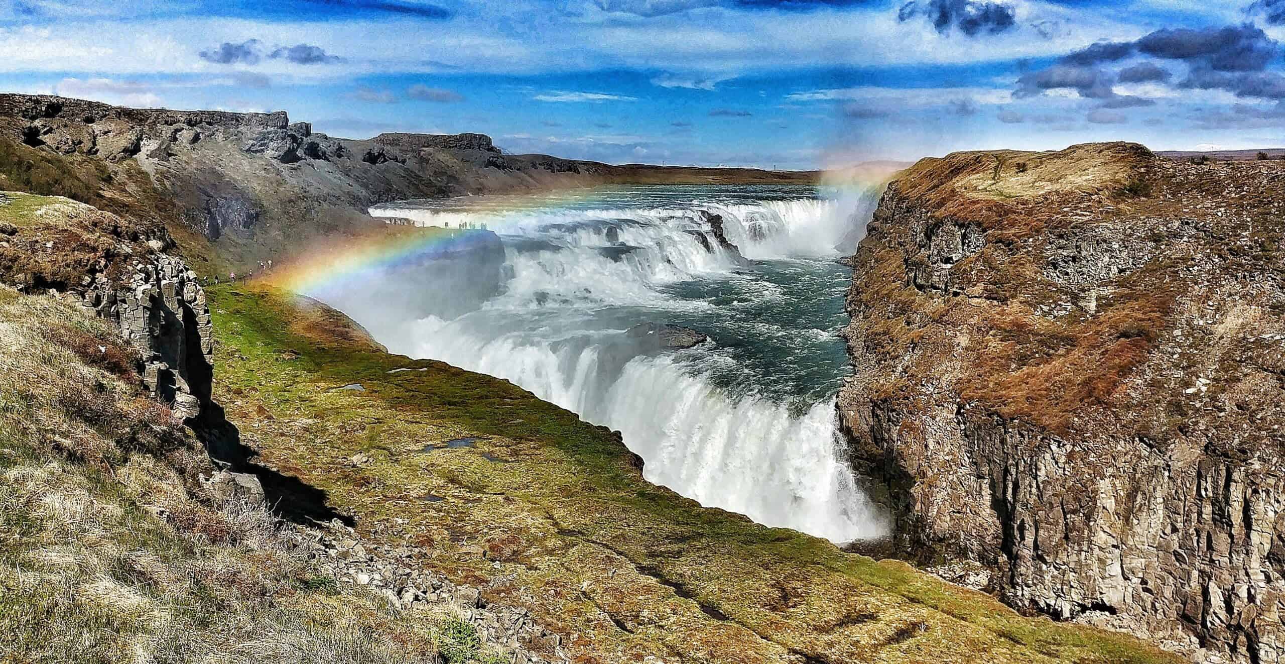 Gullfoss waterfall with rainbow, part of South Iceland's famous Golden Circle tour.