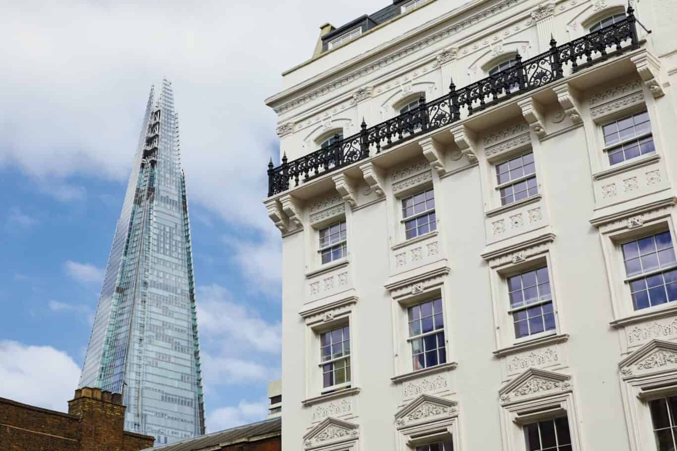 London Bridge Village Hostel building with The Shard in the background.
