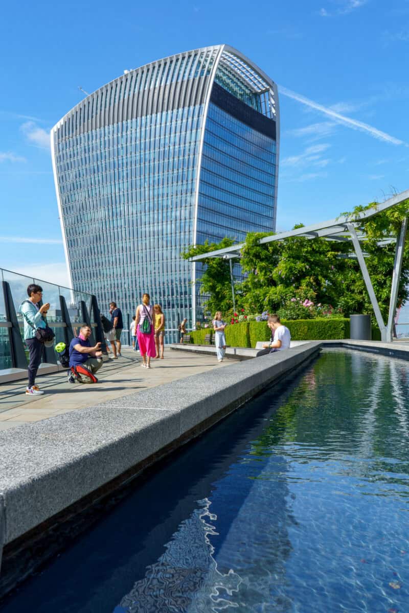 View of St Christopher's London Bridge hostel with cityscape and modern building in the background.