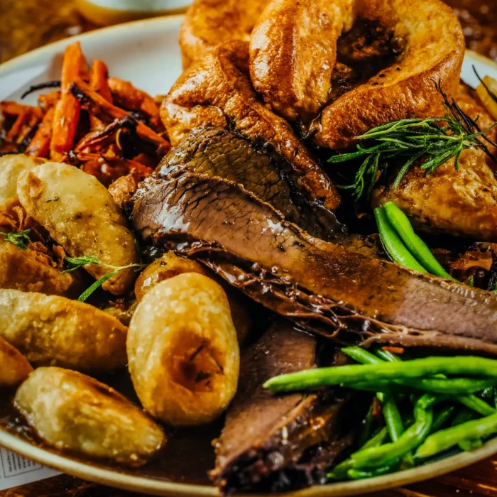 Sunday roast with beef, roast potatoes, Yorkshire pudding and vegetables at The Hercules Pillars, Holborn
