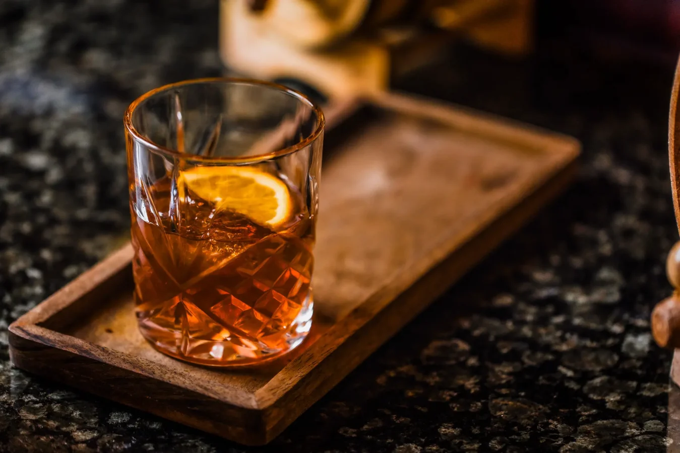 Old fashioned cocktail with orange slice served at The Hercules Pillars pub bar, Great Queen Street, Holborn