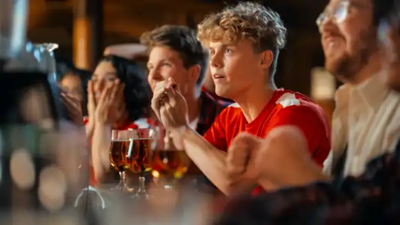 Young people watching Nations Championship 2026 at St Christopher's Pub.