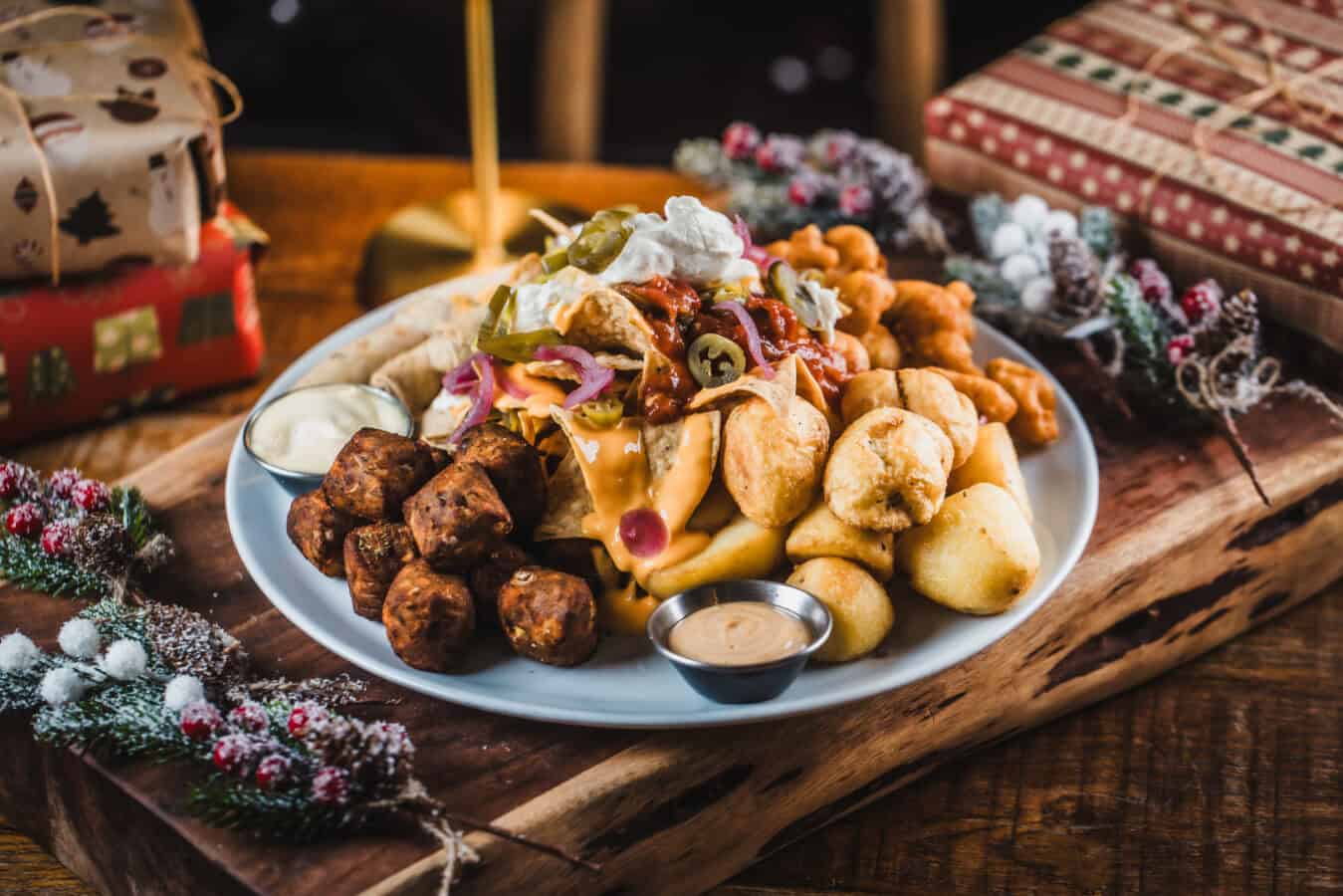 Traditional pub food platter with meatballs, fries, and toppings at St Christopher's Pub.