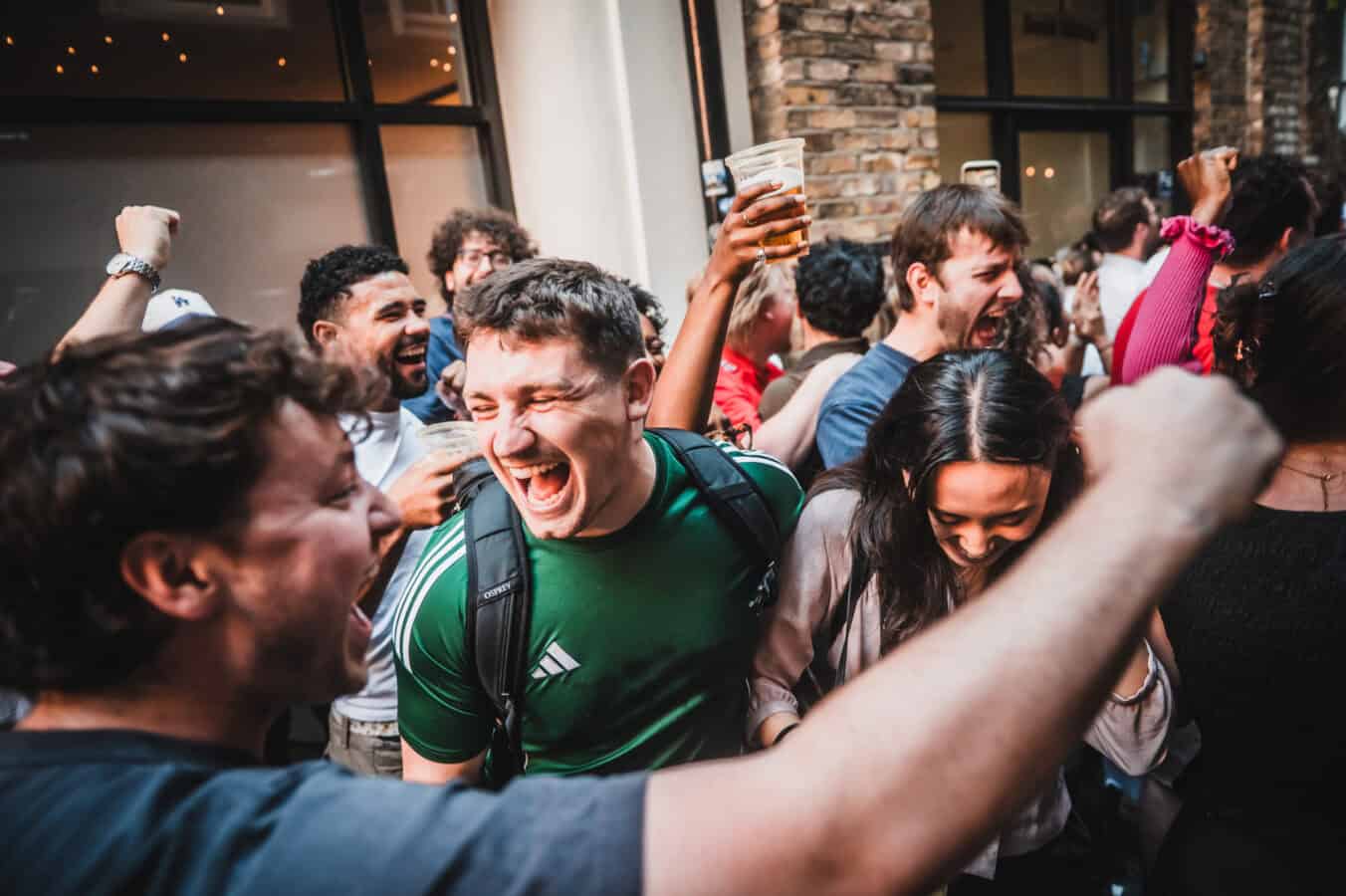 Happy group enjoying drinks and socialising at St Christopher's Pub.