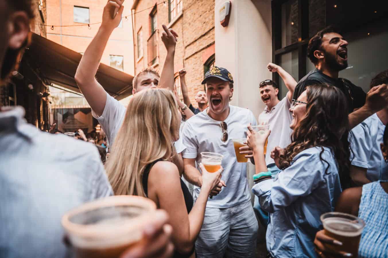 People enjoying drinks and socialising outside St Christopher's Pub.