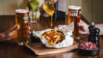 People enjoying beer and food at St Christopher's Pub.