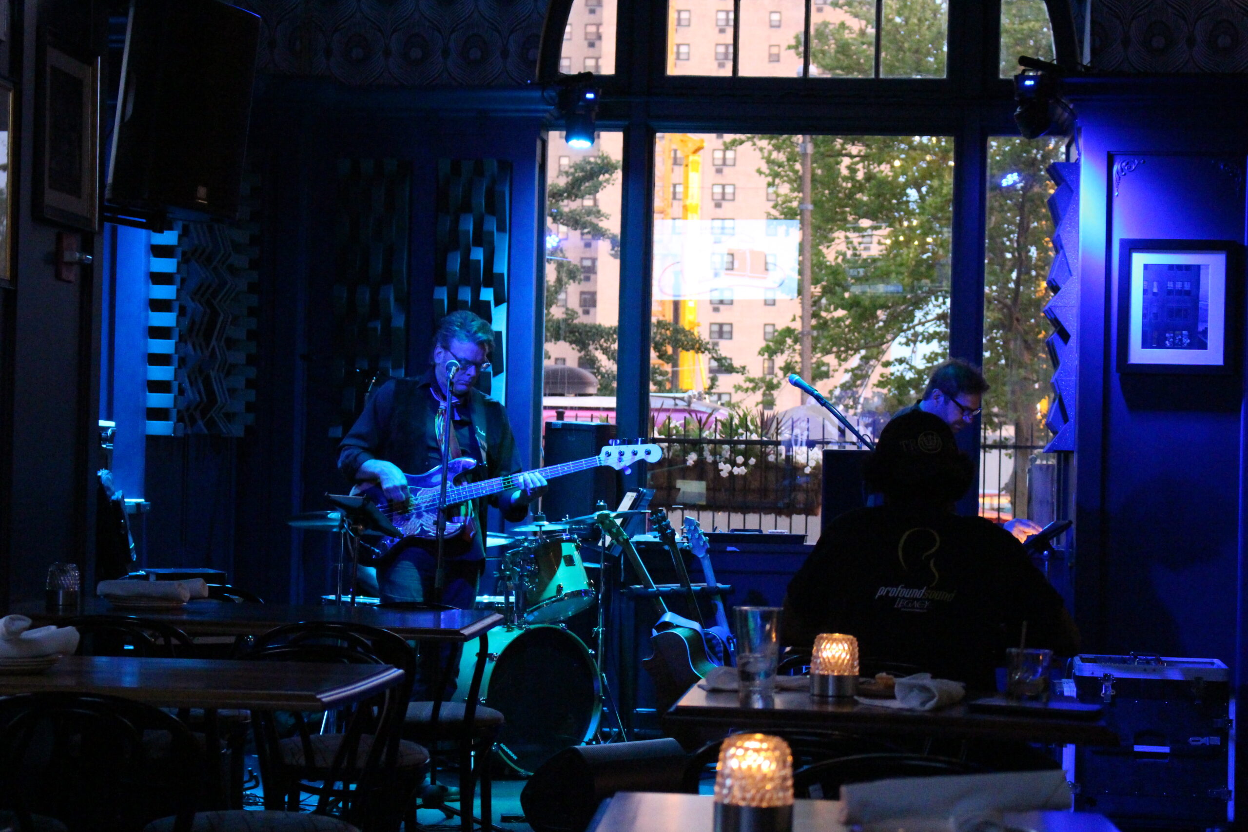 Band performing in blue stage lighting at The Chase Club