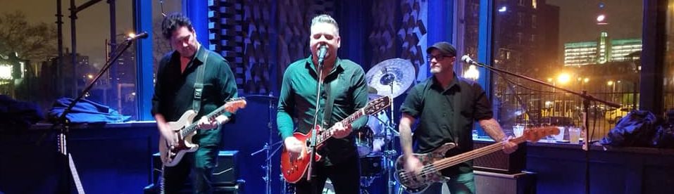 Live band performing on stage at The Chase Club