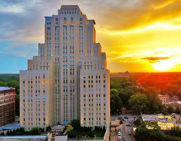 The Chase Park Plaza tower against a golden sunset in St. Louis