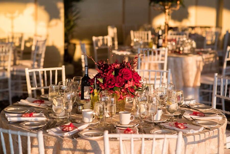 Elegant wedding reception table with floral centerpiece at Candlewood Inn ballroom.