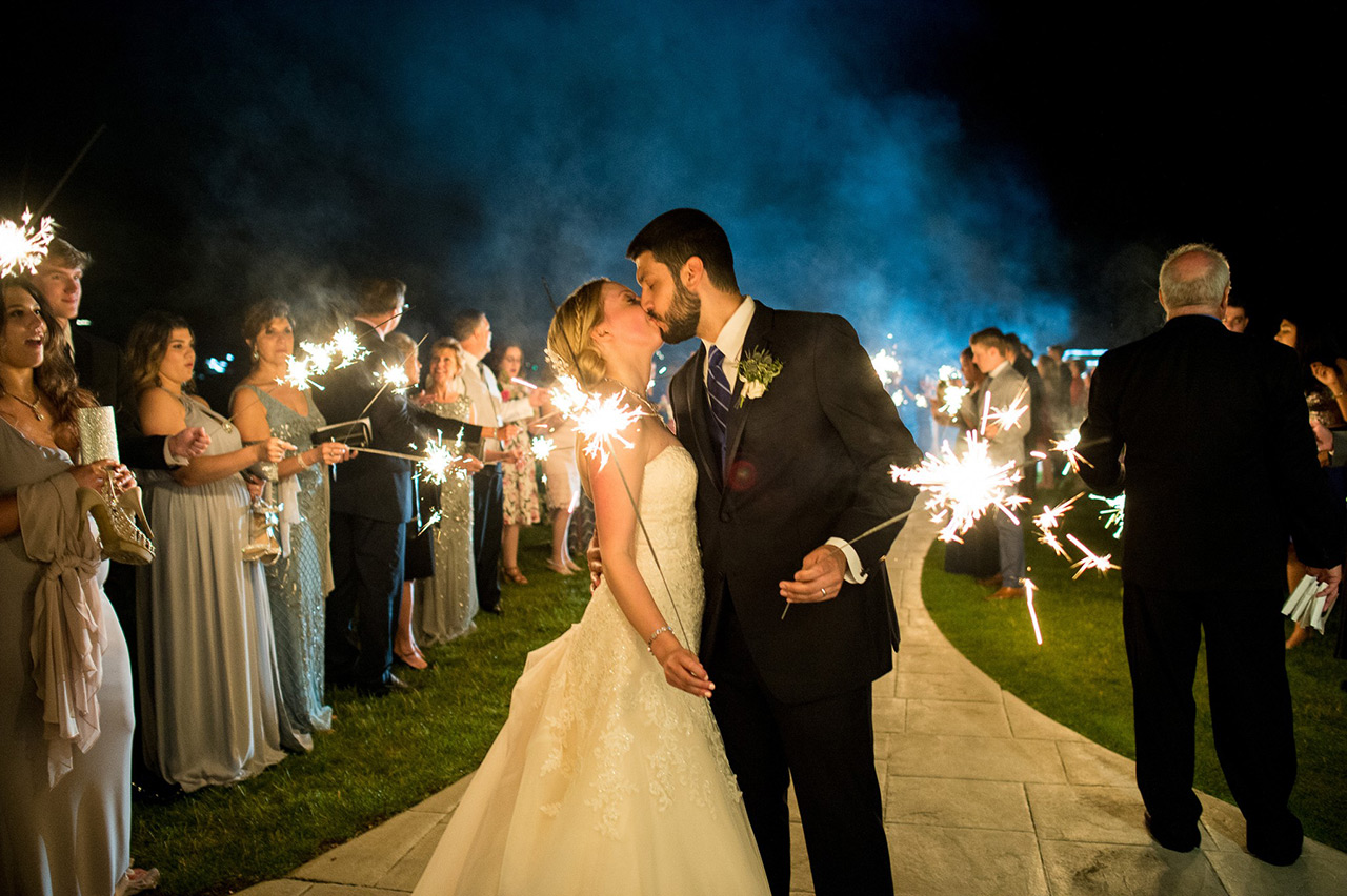 Megan and Anthony's wedding sparkler send-off at Candlewood Inn lakeside venue.