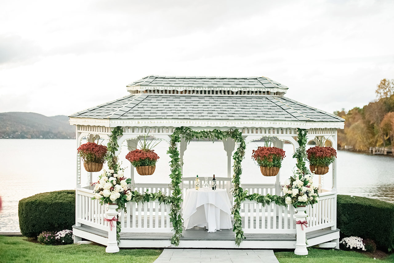 Lakeside wedding gazebo decorated with florals for a Candlewood Inn ceremony.