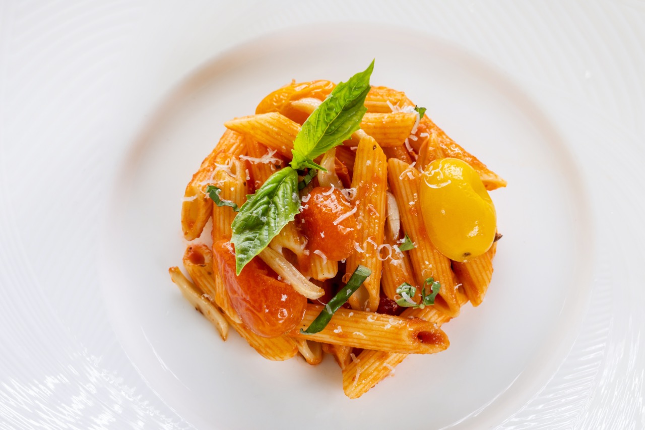 Tomato basil penne pasta with roasted tomatoes, fresh basil, and grated Parmesan cheese.