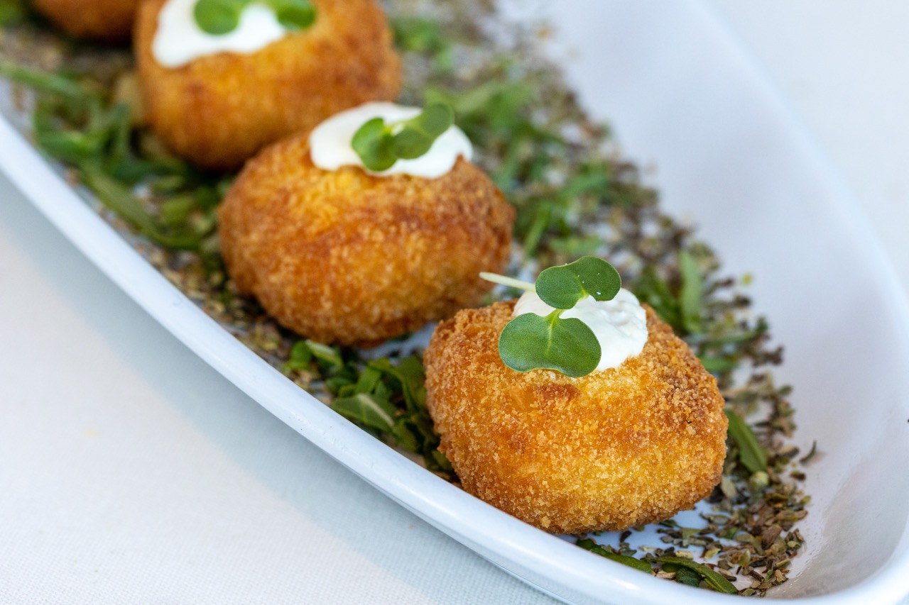 Chicken Cordon Bleu bites garnished with microgreens at a Candlewood Inn reception.