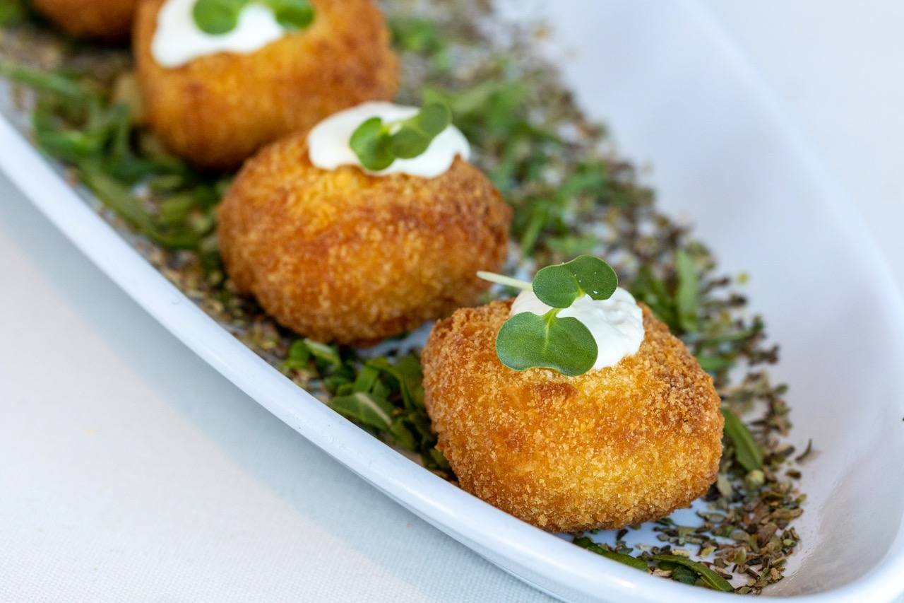Chicken Cordon Bleu bites garnished with microgreens at a Candlewood Inn reception.