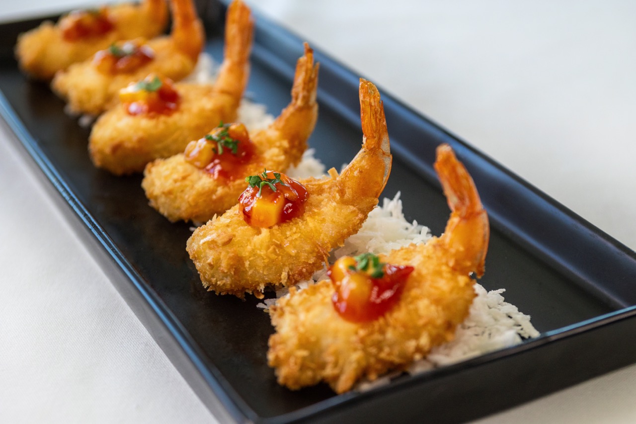 Coconut shrimp with sweet chili glaze served as a Candlewood Inn reception appetizer.