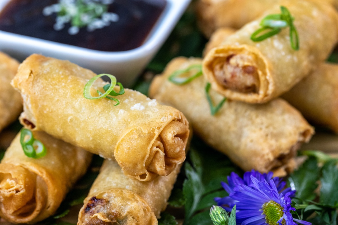 Vegetable spring rolls served with dipping sauce at a Candlewood Inn event reception.