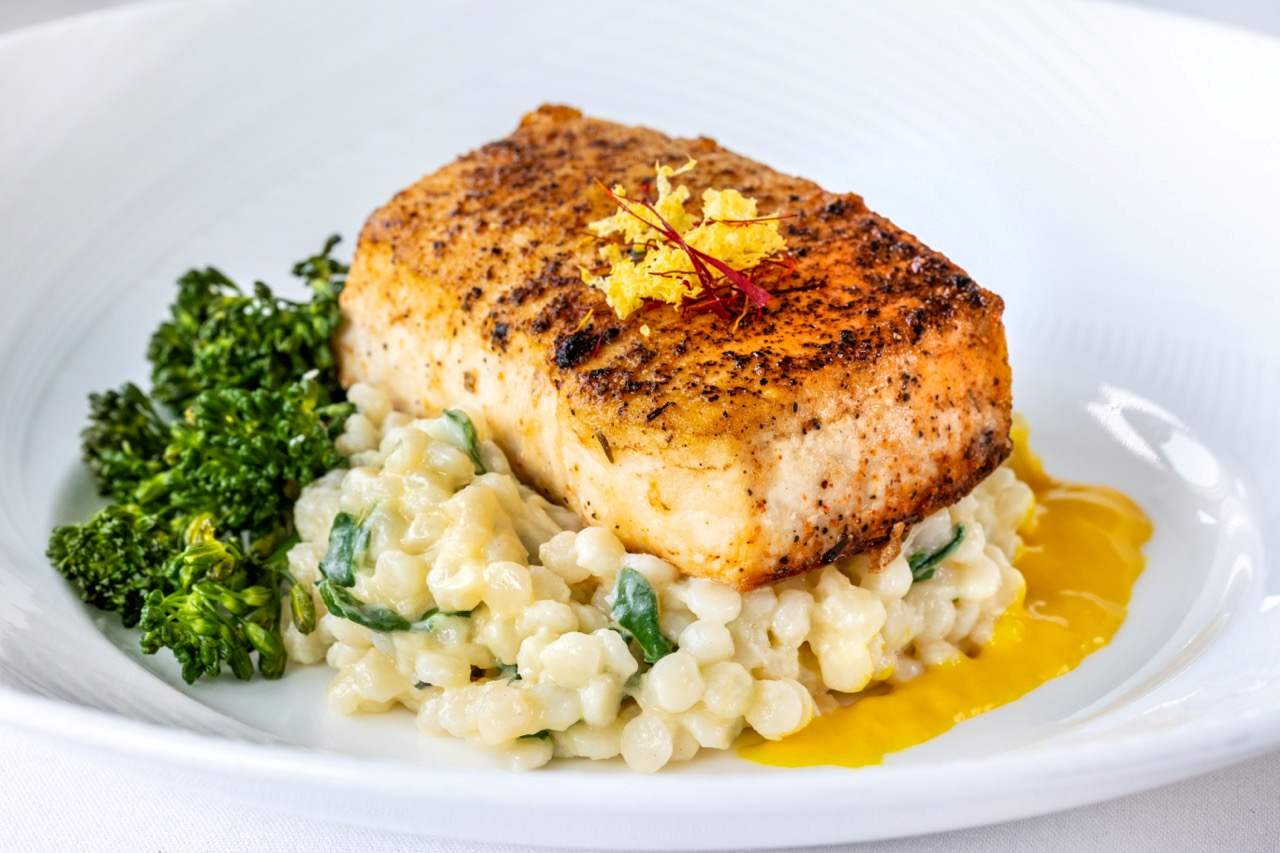 Mahi mahi served with pearl couscous and broccolini at a Candlewood Inn reception.