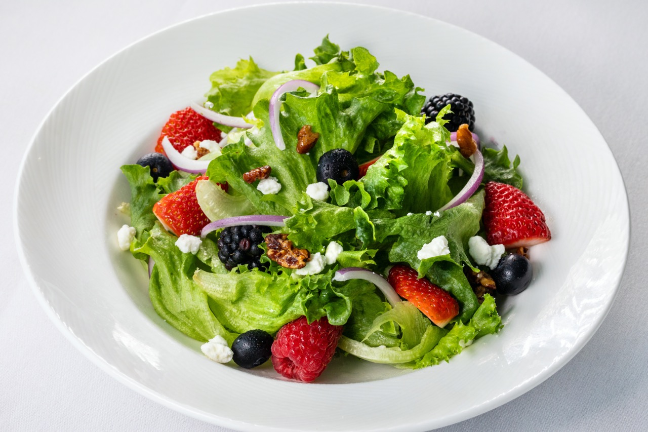 Summer salad with fresh berries, goat cheese, and pecans served at Candlewood Inn.