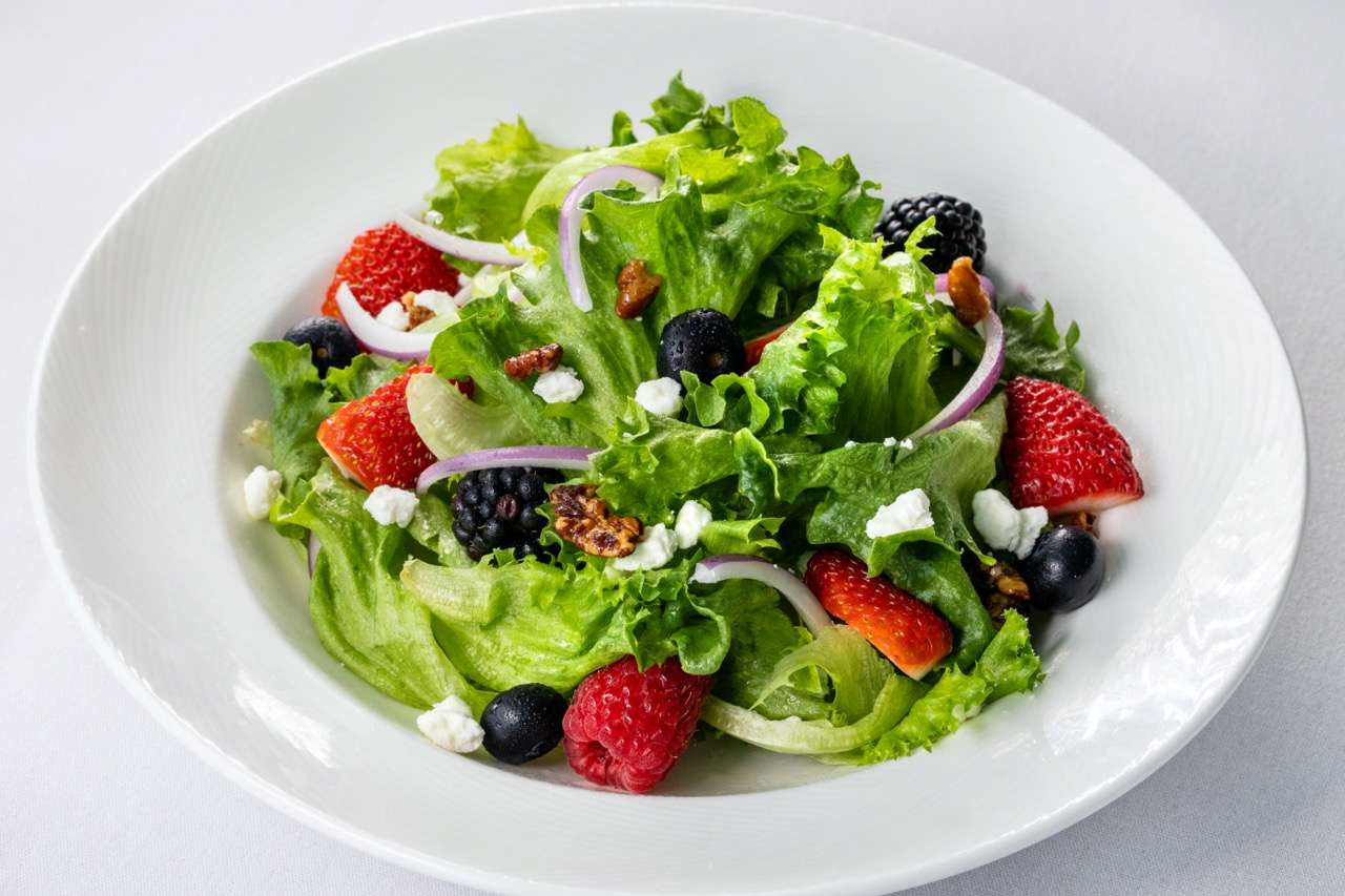 Summer salad with fresh berries, goat cheese, and pecans served at Candlewood Inn.