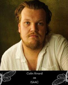 Portrait of Colin Rinard portraying Isaac, with a serious expression, wearing a white shirt against a dark background.
