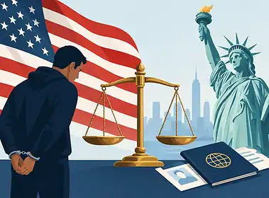 Man in handcuffs with American flag and Statue of Liberty in background.