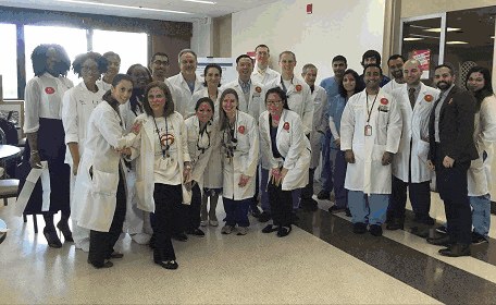 University Hospital staff gathered in a hospital lobby